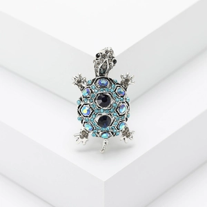Fashionable vintage turtle brooch with blue and black rhinestones on silver metal base