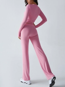 Rear view of pink Y2K long sleeve top and matching pants set for women in high quality