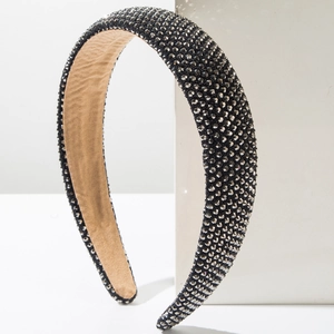 Detailed side view of high-dome sponge headband with shimmering dark grey rhinestones