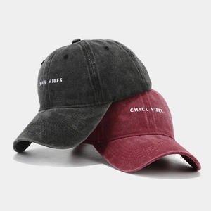 Washed cotton baseball caps with Chill Vibes embroidery in charcoal and burgundy colors