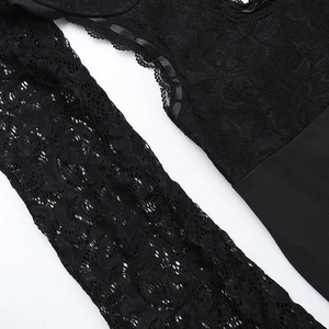 Macro shot of delicate floral lace pattern and high-quality stitching on a black bodysuit