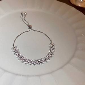 Close-up of a silver-toned slider bracelet with double-row sparkling cubic zirconia