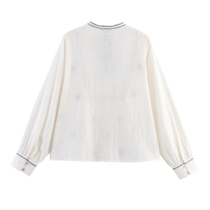 Back view of a casual retro embroidery blouse in beige cotton linen with wavy trim details