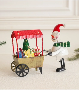 Détail du chariot de bonhomme de neige de Noël en métal avec lumières LED et cadeaux