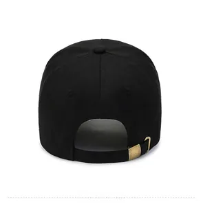 Rear view of black cotton baseball cap showing vintage gold metal adjustable strap buckle