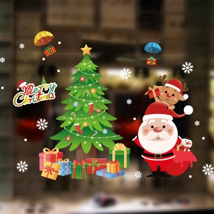 Detail of Christmas window stickers featuring Santa, reindeer and tree decorations