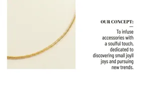 Macro detail showing the texture of a gold-plated snake chain necklace with a square pendant