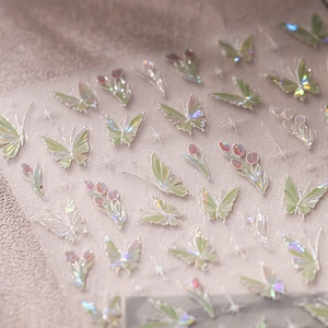 Holographic butterfly and tulip nail art stickers with laser floral patterns on light fabric
