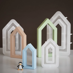 Detailed view of hollow house-shaped silicone molds for DIY resin and plaster casting