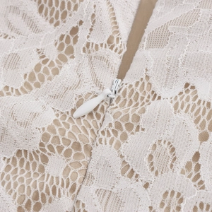Elegant white lace two-piece set featuring intricate floral patterns and hidden zipper