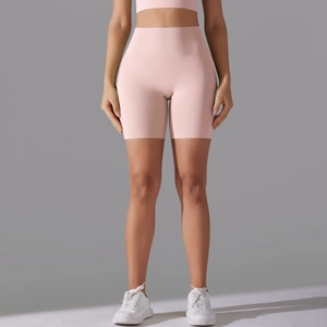 Detail of high-waist pink seamless yoga shorts showing breathable moisture-wicking fabric