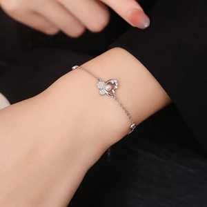 925 silver bracelet featuring a butterfly charm with pearl and crystals on a wrist