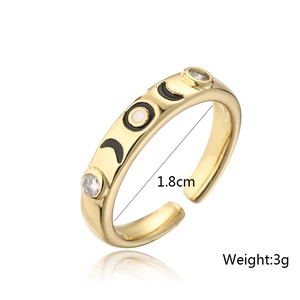Detailed view of 18K gold ring with crescent moon pattern, zircons, and size markings