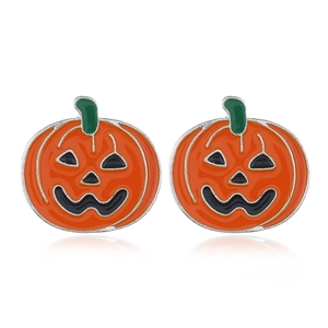 Macro detail of Halloween pumpkin stud earrings with orange enamel and green stem