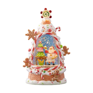 Christmas tree snow globe decoration with Santa Claus and gingerbread man ornaments