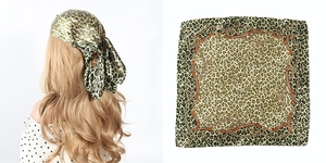 Detailed close-up of 60cm square scarf with classic leopard print and green chain pattern