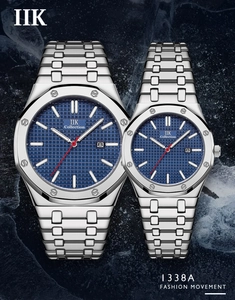 Detail of silver stainless steel couples watches with blue textured dial and date display
