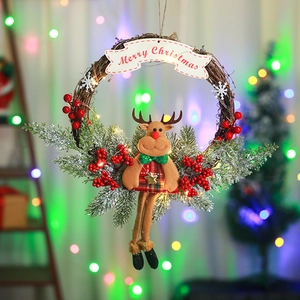 Close-up of a Christmas reindeer wreath with LED lights and Merry Christmas banner