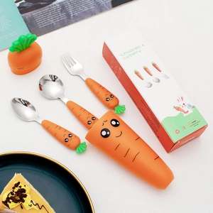 Detail of carrot-shaped stainless steel toddler cutlery set with portable storage case