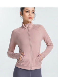 Detail of slim-fit yoga jacket featuring a stand collar and smooth front zipper closure