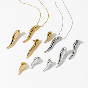 Minimalist chili pepper pendant necklace and earrings set in gold and silver finish