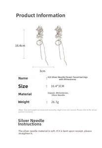 Macro shot of 925 silver needle drop earrings with sparkling rhinestone floral tassels