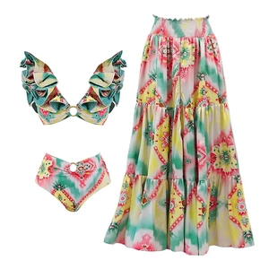 Close-up of bohemian print bikini top with layered ruffles and golden ring hardware