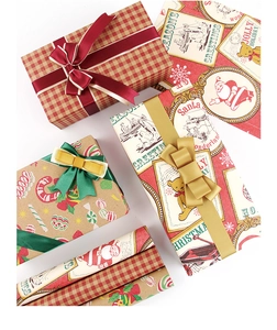 Detail of vintage Christmas wrapping paper with Santa, bear motifs and festive ribbons