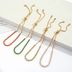 Detailed view of four colorful zircon adjustable bolo bracelets on a white display stand