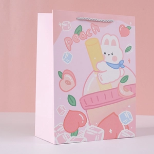 Detail of pink starry peach gift bag with silver nylon handles and bunny illustrations