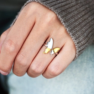 Elegant S925 sterling silver butterfly ring in two-tone gold and silver on model hand