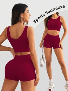 Detail of burgundy seamless ribbed knit sports set featuring high-waisted shorts and U-back top