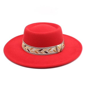 Classic red wool felt fedora with a flat wide brim and geometric patterned hat band