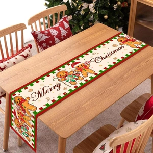 Christmas gingerbread man table runner on wooden table with Merry Christmas text
