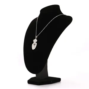 Polished stainless steel mother and child pendant necklace on a black jewelry stand