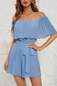 Detail of light blue off-shoulder pleated mini dress with adjustable waist tie on model
