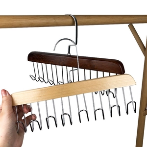 Multifunctional wooden hanger with 12 metal hooks for organizing ties and belts in closets