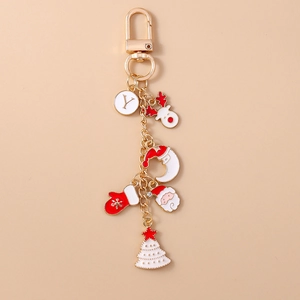 Detailed Christmas keychain featuring Santa, reindeer, and letter Y on pink background