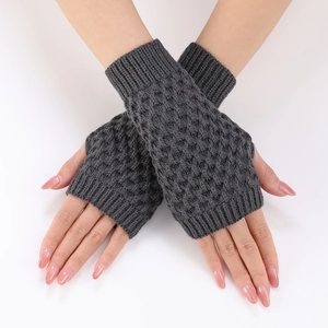 Detail of dark grey knit fingerless gloves with elegant diamond pineapple pattern texture