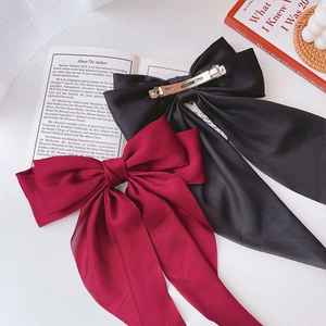 Elegant large satin bow hair clip with long ribbons in red and black colors