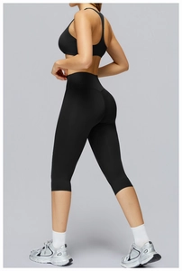 Detailed back view of a black racerback sports bra and high-waist yoga leggings set