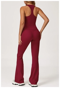 Rear view of maroon yoga set featuring a racerback tank top and flared fitness pants