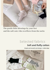 Detail view of breathable cotton mesh crew socks with rolled cuffs in soft pastel colors