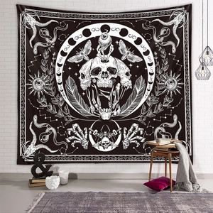 Gothic tapestry with moth and moon phases hanging on a white brick wall in a modern room