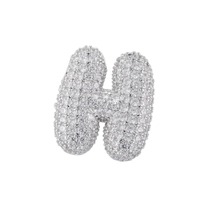 Macro shot of silver letter H pendant with pavé cubic zirconia in a bubble style