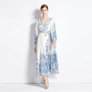 Ethnic V-neck maxi dress with long sleeves and blue floral prints on white fabric
