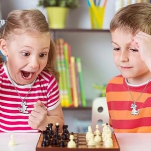 Minimalist silver BFF cat hug pendant necklace for kids playing chess at home