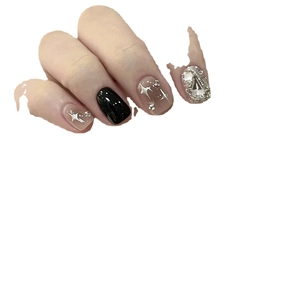 Handmade short black press-on nails with silver glitter stars and luxury diamond accents