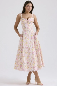 Detail view of the floral print pattern and slim waist design on this pink summer dress