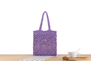 Detailed macro view of purple hand-woven cotton rope handbag with white cloth lining